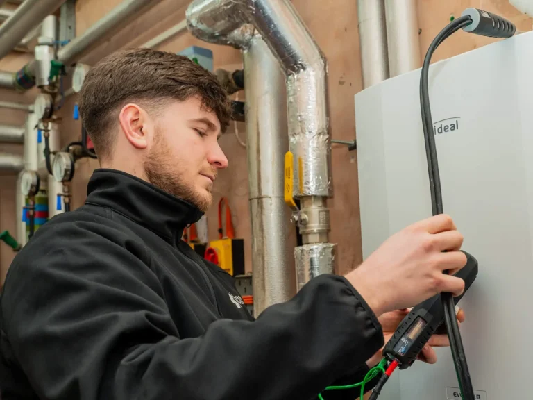 engineer inspecting a boiler