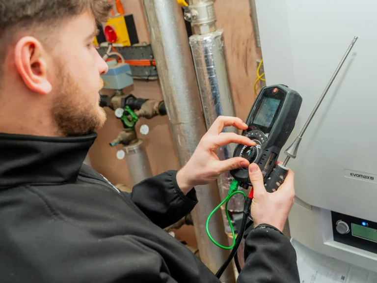 heating engineer working on boiler inspection